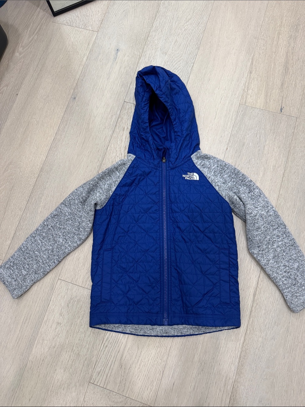 The North Face Royal Blue Quilted Hooded Jacket with Gray Sleeves